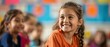 © LittleDreamStocks - Smiling young girl in a classroom setting.