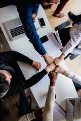 Canvas Print - Business people join hand together during their meeting, confirm engagement or unity in collaboration, commitment in teamwork, top view.