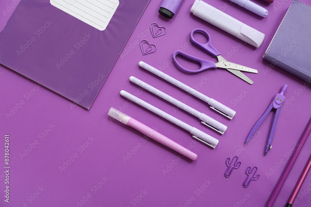 Different stationery on purple background
