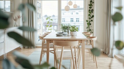 A Scandinavian-inspired dining space with clean lines, light wood, and greenery accents