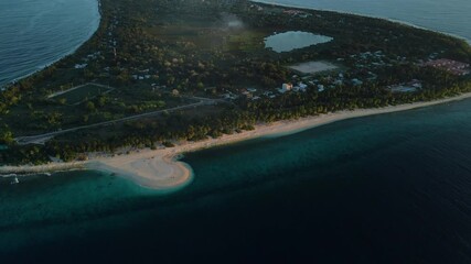 Wall Mural - Drone view of Fuvahmulah island with beach and ocean with soft evening sunlight.