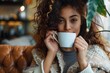 © Dina - beautiful diverse woman at home apartment drinking coffee, candid lifestyle moment