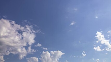Wall Mural - Sunny Blue Sky With Rolling Cumulus Clouds In Summer. low angle, timelapse