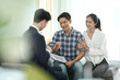 © Prathankarnpap - Financial adviser consulting adult asian couple about terms of investment contract