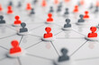 © tonstock - Abstract representation of a network with red and gray human icons connected, symbolizing communication, teamwork, and social connections.