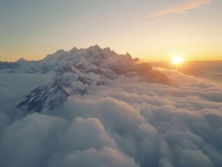 Wall Mural - majestic aerial view of snowcapped mountain range piercing through cloud layer bathed in golden sunrise light