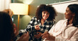 © peopleimages.com - Popcorn, sleepover and smile with woman friends in bedroom of home together for bonding at night. Conversation, love and relax with happy people on bed in apartment for evening chilling on weekend