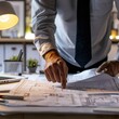 © niti - Close-up of a CEO's hands pointing at project blueprints, soft desk lamp lighting, detailed and organized workspace, professional documents, focused and precise scene