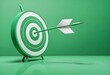 © Lied - A green target with a white arrow hitting the bullseye, on a plain green background