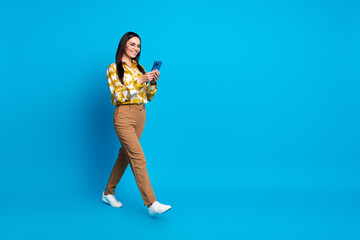 Sticker - Photo of glamour elegant woman wear trendy clothes chatting going empty space isolated on blue color background