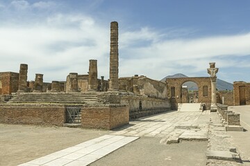 View of the historic ruined city of Pompeii in Italy with the volcano Vesuv