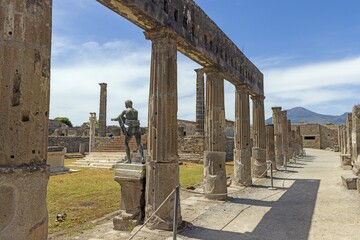 View of the historic ruined city of Pompeii in Italy with the volcano Vesuv