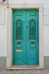 Vintage old-fashioned door of vivid blue colour from Portugal