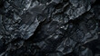 © sornram - High-resolution close-up of dark, textured rocks showcasing intricate details and abstract formations, perfect for backgrounds and design projects.