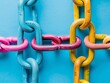 © Pornarun - Abstract image of four colorful chains connecting, creating a pattern on a blue background.