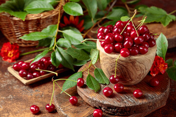 Poster - Ripe red cherries in a wooden dish.