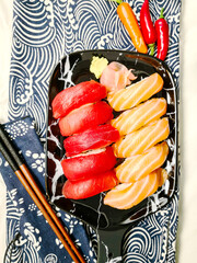 Wall Mural - Fresh sushi, traditional Japanese food on the table