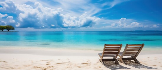 Two Empty Loungers on a Pristine Tropical Beach