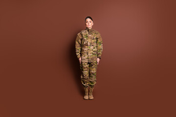 Poster - full size photo of pretty senior female courageous servicewoman stand wear camouflage military unifo