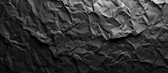 Fototapete - Background featuring a texture of crumpled black paper with a design suitable for including copy space image.