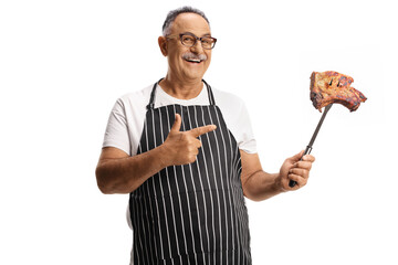 Poster - Mature man pointing at a cooked meat on a fork