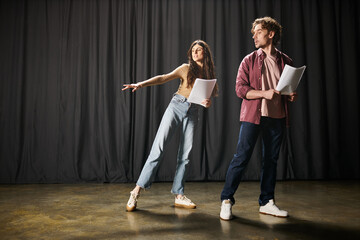 Wall Mural - A stylish man and woman perform on a theater stage.