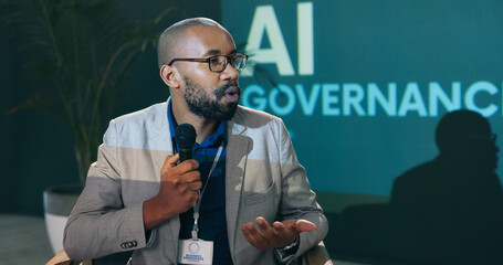 Conference, presentation and black man with mic in discussion for event, workshop and future development. IT, seminar and person with speech for ai governance, ethical guidelines and machine learning