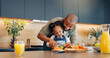 © WesSide/peopleimages.com - Sandwich, dad or prepare meal with child for development, learning or nutrition at home. Kid, father or help with knife for education, lunch time or growth with fresh produce for wellness and health