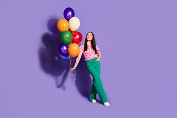 Canvas Print - Full length photo of lovely young lady hold look air balloons dressed stylish pink garment isolated on violet color background