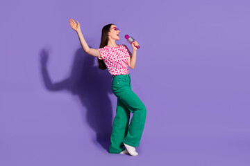 Sticker - Full body photo of attractive young woman sing microphone karaoke dressed stylish pink clothes isolated on violet color background