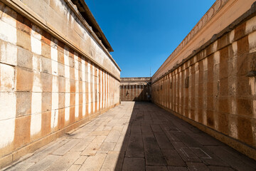 Sticker - A stone corridor between striped walls at the ancient Jain temple in Shravanabelagola.