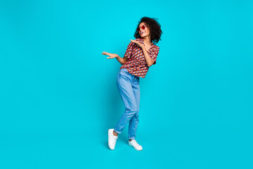 Wall Mural - Photo of positive cheerful girl look copyspace dancing party isolated cyan color background