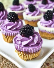 Wall Mural - Mini Blackberry Cheesecakes with blackberry filling, then whipped cream colored with violet gel