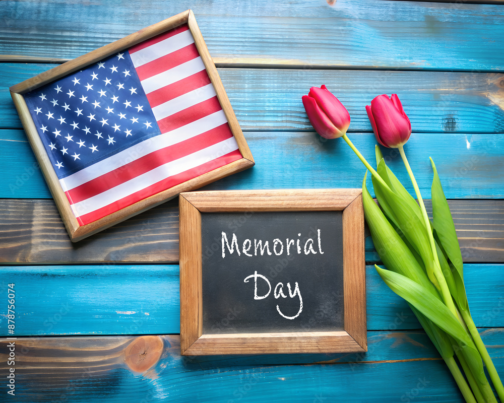 US American flag with blackboard and tulip flower on blue wooden ...