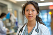 © Echelon IMG - portrait of a female asian doctor in the hospital, smiling woman, stethoscope