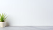 © ahmednadia - Minimalist white wall, green plant, and grey floor, perfect for product placement and showcasing modern design.