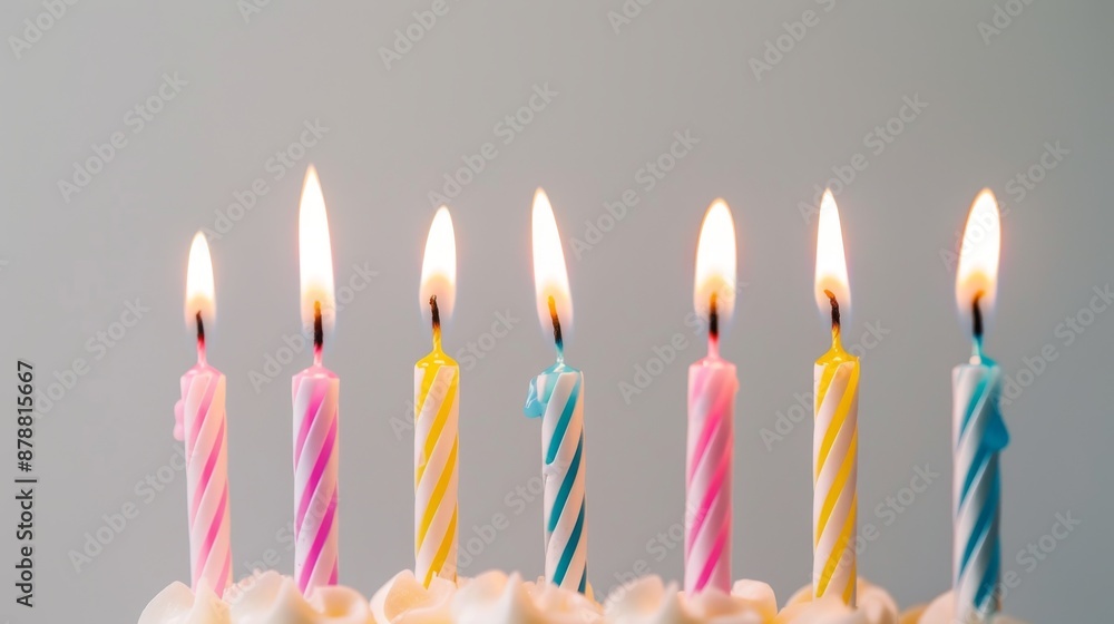 birthday cake with a row of lit birthday candles on top. A Festive ...