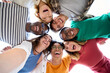 © CarlosBarquero - Selfie from below of large group of diverse friends posing hugging in circle looking excited at camera. Cheerful young people standing embracing outdoor. Photo of generation z enjoying sunny meeting