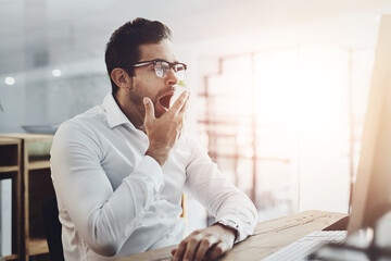 Wall Mural - Tired, yawn and business man in office on computer for deadline on web design, project and research. Corporate, burnout and exhausted, fatigue and overworked worker in morning on pc for website ui