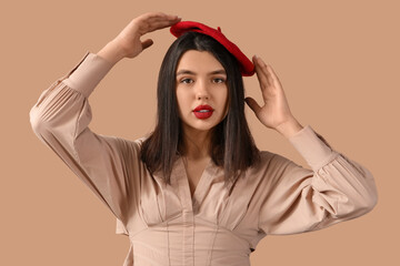 Poster - Beautiful young woman with red lips on brown background