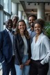 © Minerva Studio - Diverse group of business people smiling in modern office building