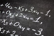 © Binkontan - Algebra equation on chalk board. Math concept, teaching algebra written equation.