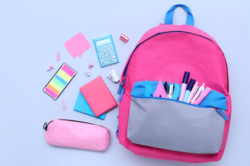 Wall Mural - Composition with different stationery and stylish school backpack on color background