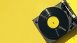 © TheWaterMeloonProjec - Trendy vinyl record on retro turntable with yellow label and gray shadow on yellow backdrop