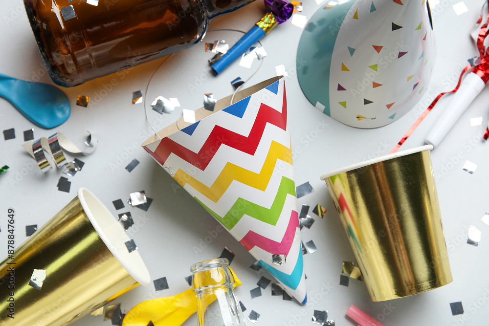 Composition with cardboard party decor and confetti on grey background