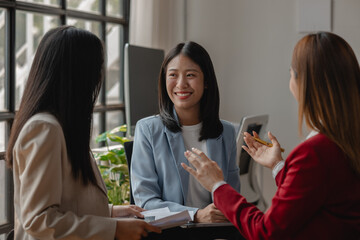 businessperson works together to shear an idea to each other, one of an employee of this group is explaining information about the project that how far they have been working on