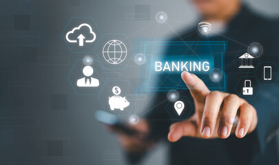 Aufkleber - Businessman holding word banking in hand with icon network connection on virtual screen dark background