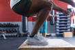 © Wavebreak Media - A fit African American man performs a box jump at the gym