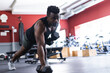 © Wavebreak Media - Fit African American man lifting weights at the gym