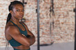 © Wavebreak Media - Confident biracial woman stands in a gym, with copy space